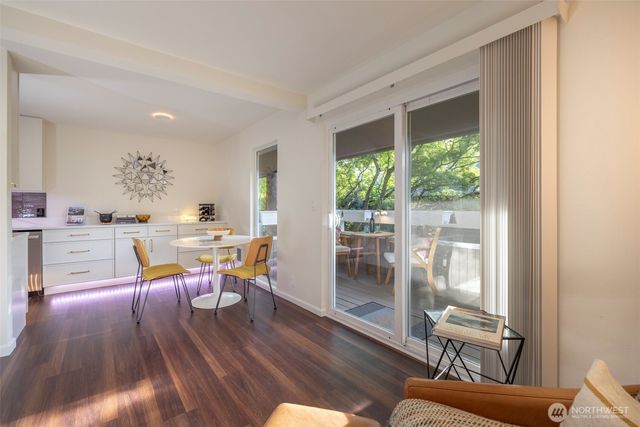 a view of a dining room with furniture window and outside view