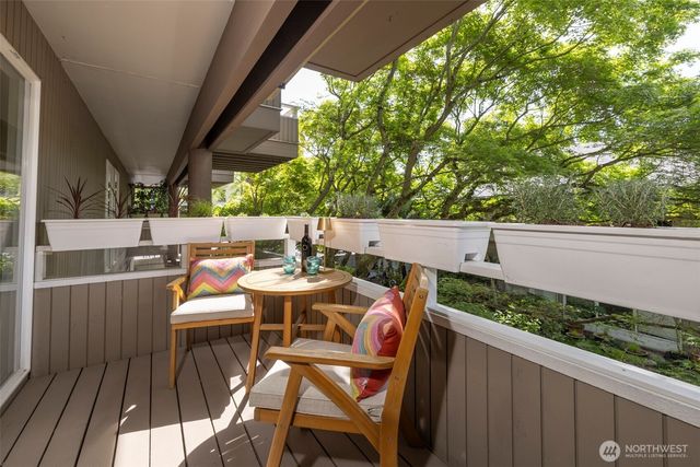 a outdoor dining space with furniture and outdoor view