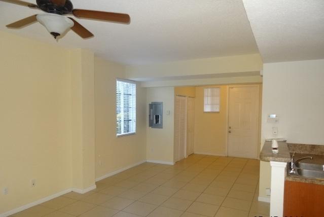1940 Freeport Drive, Unit 5015 Riviera Beach, FL 33404 - Photo 3 of 10 Living room, alternate angle
