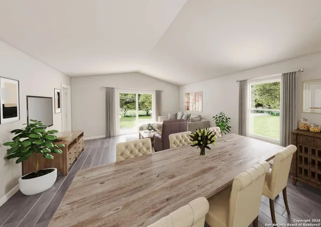 a view of a dining room with furniture and wooden floor