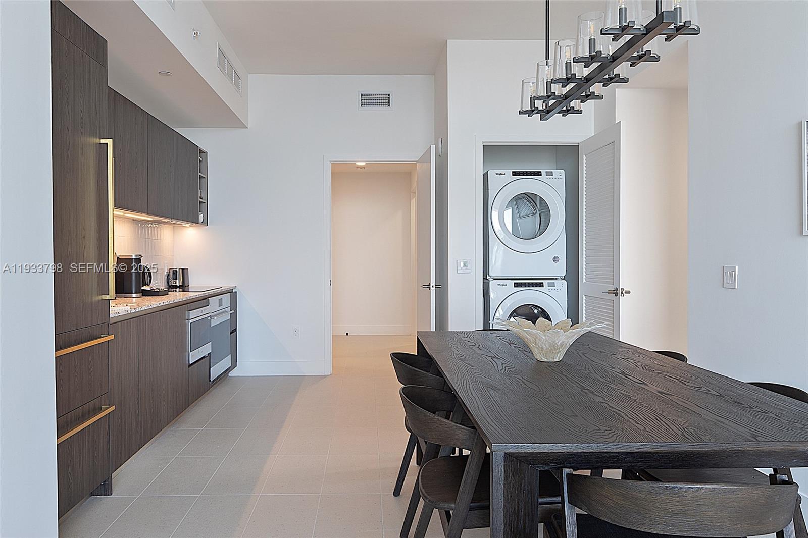 159 Northeast 6th Street, Unit 5015 Miami, FL 33132 - Photo 13 of 59 a view of a dining room with furniture and wooden floor
