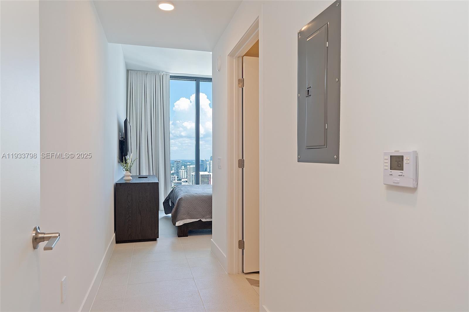 159 Northeast 6th Street, Unit 5015 Miami, FL 33132 - Photo 31 of 59 a view of bedroom with furniture and windows