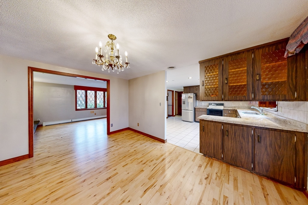 15 Rugdale Road Boston, MA 02124 - Photo 18 of 33 a kitchen with wooden floors and a sink