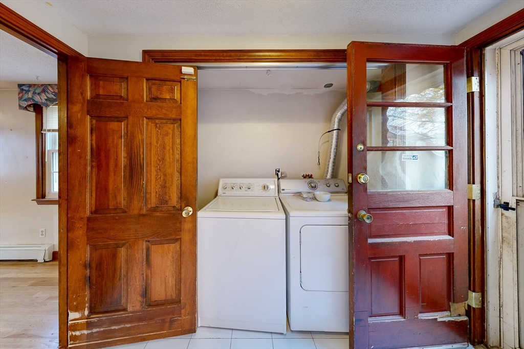 15 Rugdale Road Boston, MA 02124 - Photo 19 of 33 a utility room with dryer and washer