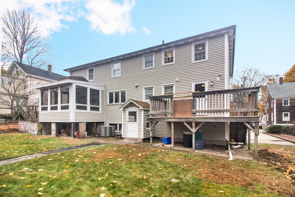 15 Rugdale Road Boston, MA 02124 - Photo 2 of 33 a view of a house with a roof deck