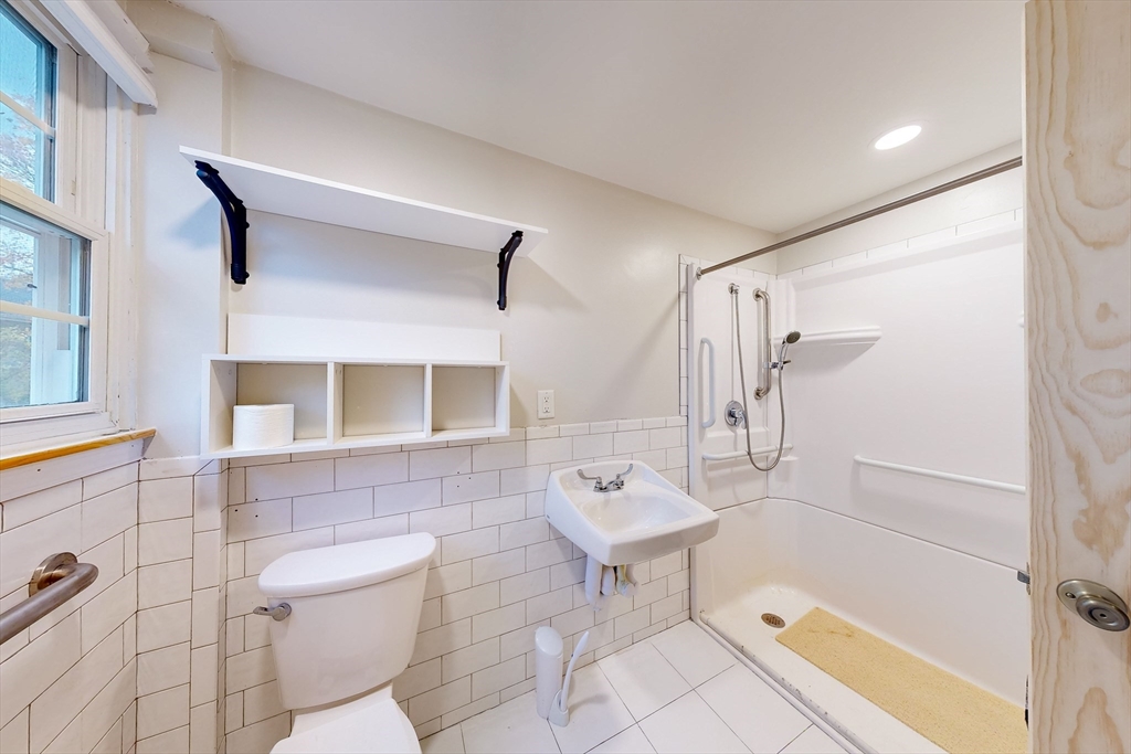 15 Rugdale Road Boston, MA 02124 - Photo 28 of 33 a bathroom with a sink toilet and shower