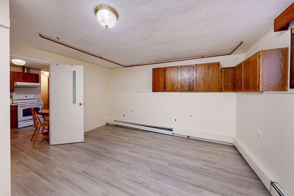 15 Rugdale Road Boston, MA 02124 - Photo 30 of 33 an empty room with wooden floor and windows