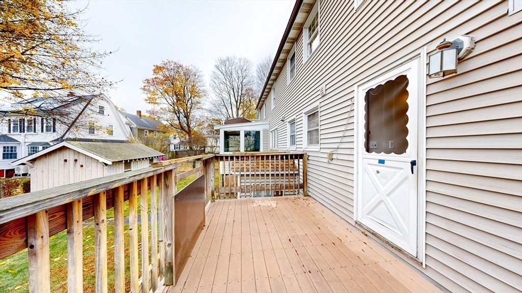 15 Rugdale Road Boston, MA 02124 - Photo 3 of 33 a view of a house with wooden deck
