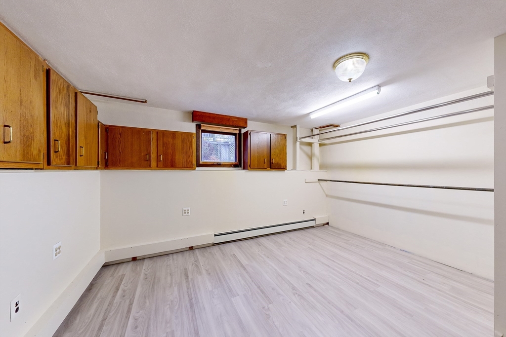 15 Rugdale Road Boston, MA 02124 - Photo 32 of 33 a view of a room with wooden floor and white walls