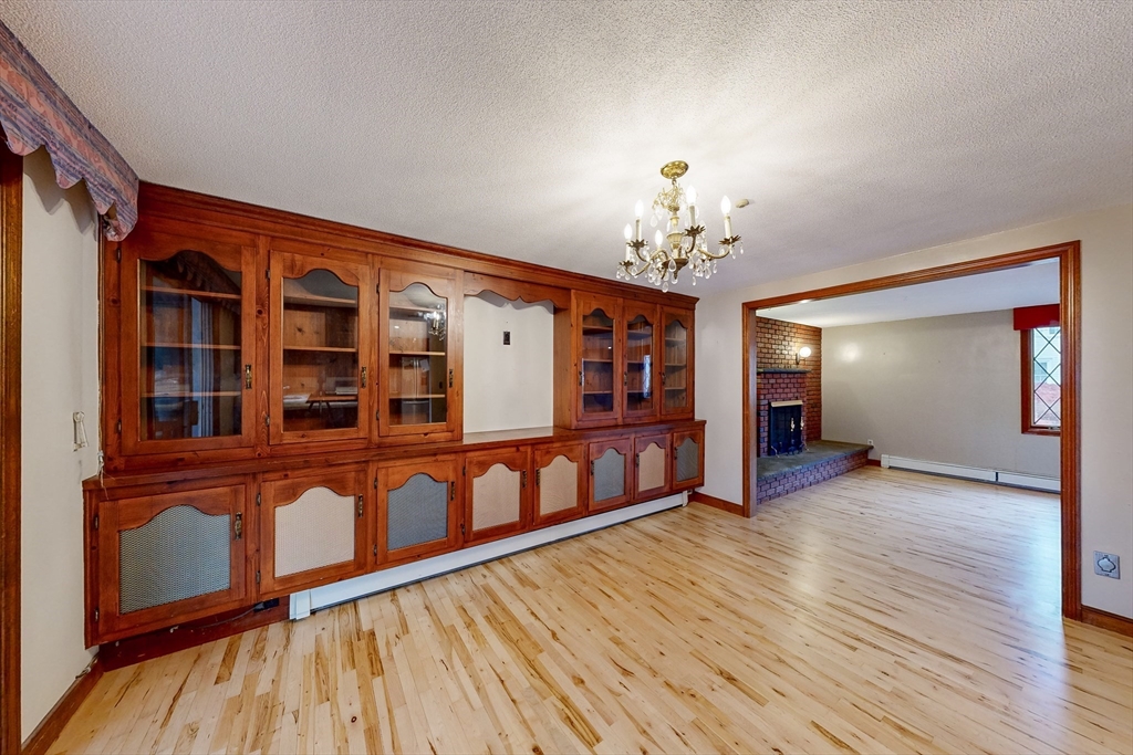 15 Rugdale Road Boston, MA 02124 - Photo 8 of 33 a view of a room with wooden floor and staircase
