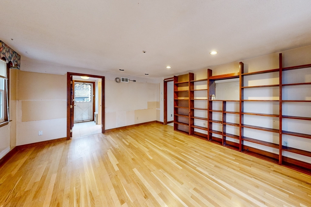 15 Rugdale Road Boston, MA 02124 - Photo 10 of 33 a view of a room with wooden floors and stairs
