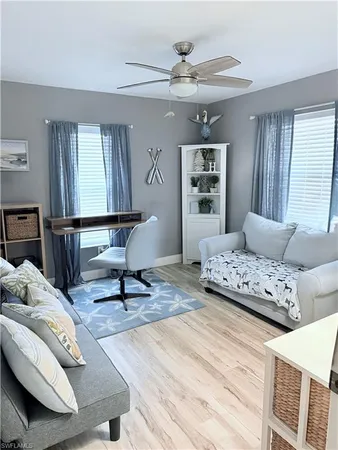 a living room with furniture and a window