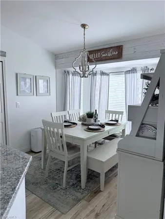 a view of a dining room with furniture and window