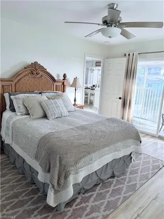 a bedroom with a bed and a mirror