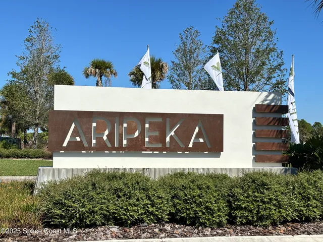 a view of building with yard and outdoor seating
