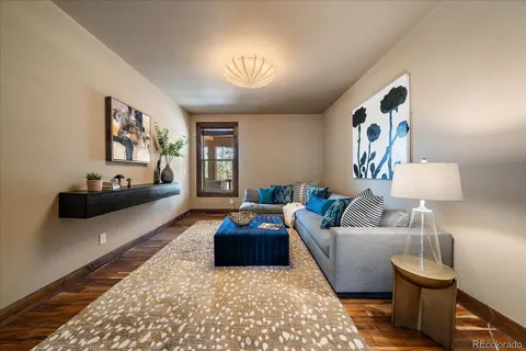 a kitchen with stainless steel appliances granite countertop a refrigerator a sink and wooden cabinets