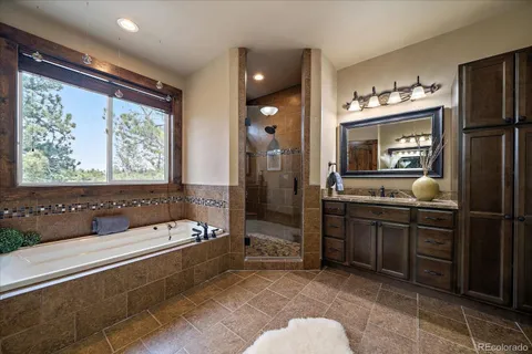 a bedroom with two beds and a chandelier