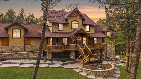 a front view of a house with yard porch and glass table