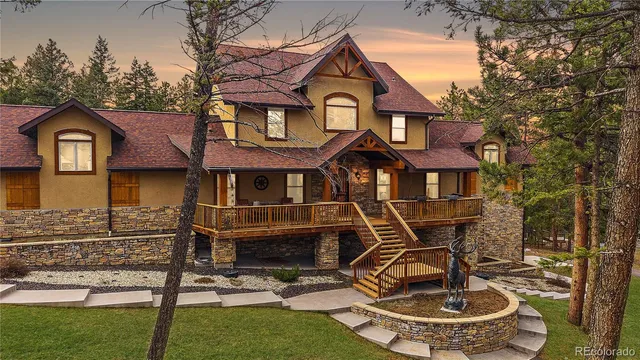 a front view of a house with yard porch and glass table
