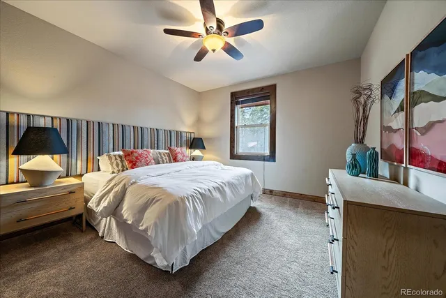 a bathroom with a tub a window and a shower