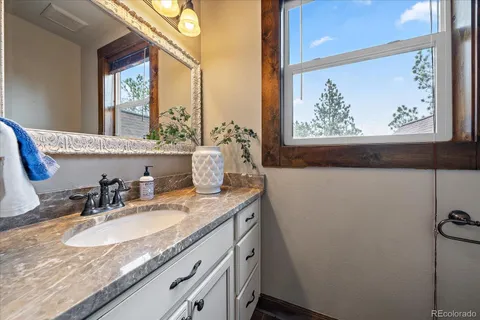 a living room with furniture a rug and a flat screen tv