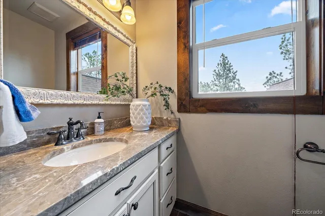 a living room with furniture a rug and a flat screen tv