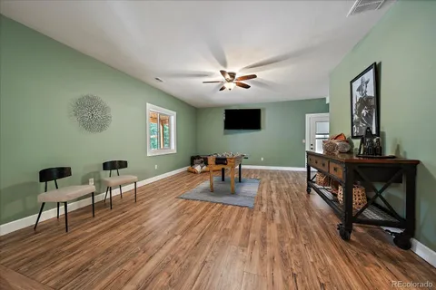 a view of a balcony with wooden floor