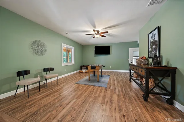 a view of a balcony with wooden floor