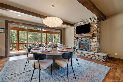 a kitchen with stainless steel appliances granite countertop a sink a stove and a refrigerator