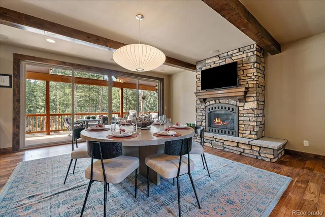 a kitchen with stainless steel appliances granite countertop a sink a stove and a refrigerator