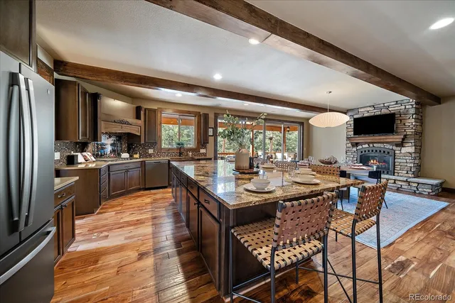 a kitchen with counter top space a sink and appliances