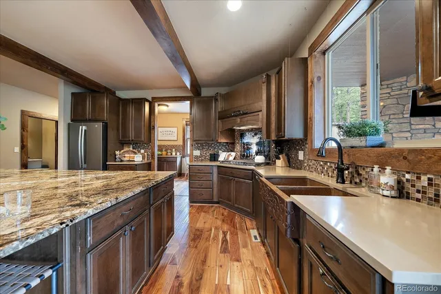 a kitchen with a stove and cabinets