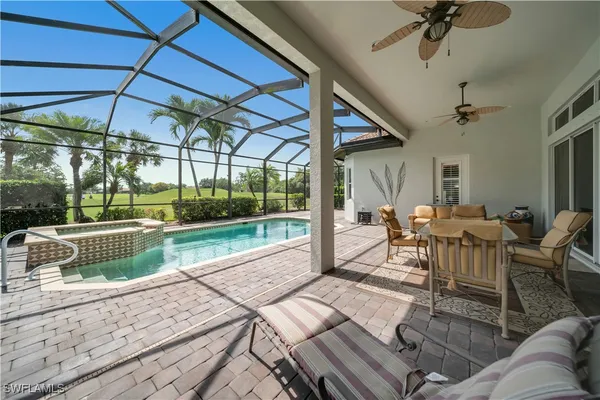 a view of a patio with table and chairs floor to ceiling window with wooden floor