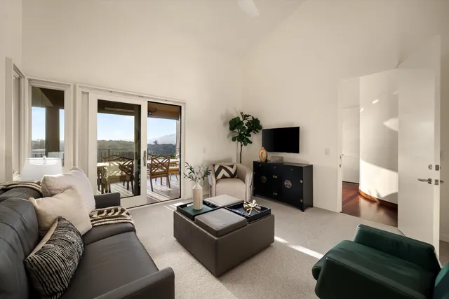a spacious bathroom with a shower sink and mirror
