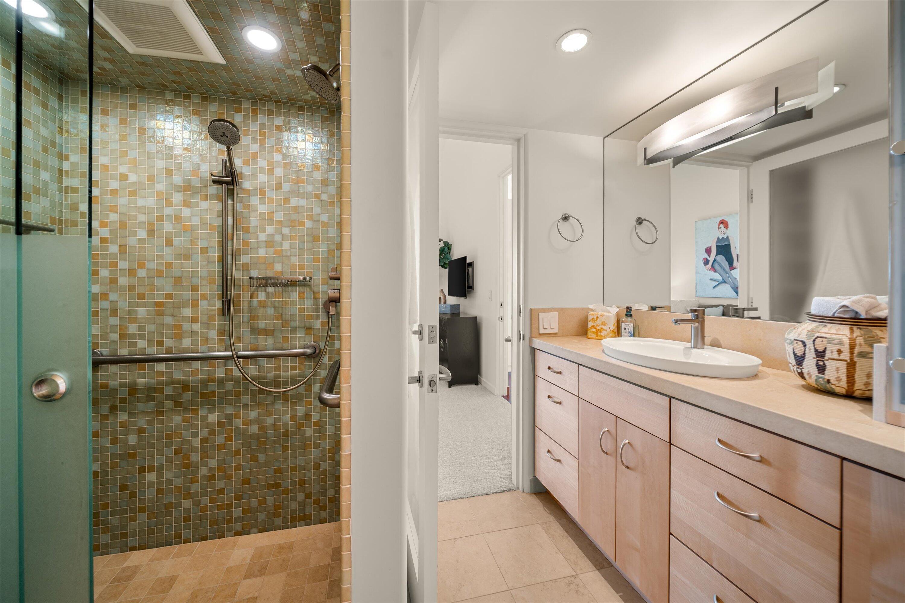 930 Monte Drive Santa Barbara, CA 93110 - Photo 20 of 49 a spacious bathroom with a shower sink and mirror