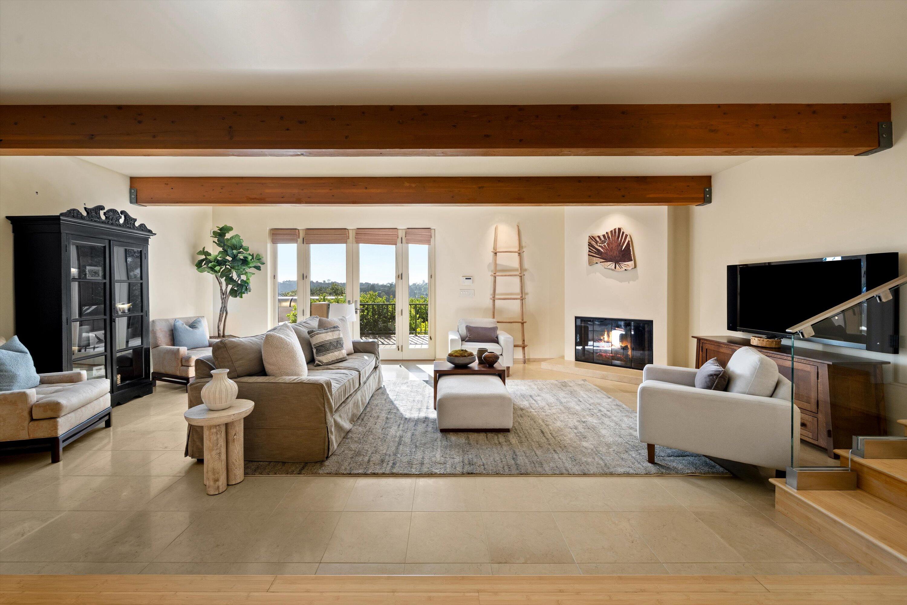 930 Monte Drive Santa Barbara, CA 93110 - Photo 24 of 49 a living room with furniture fireplace and a flat screen tv