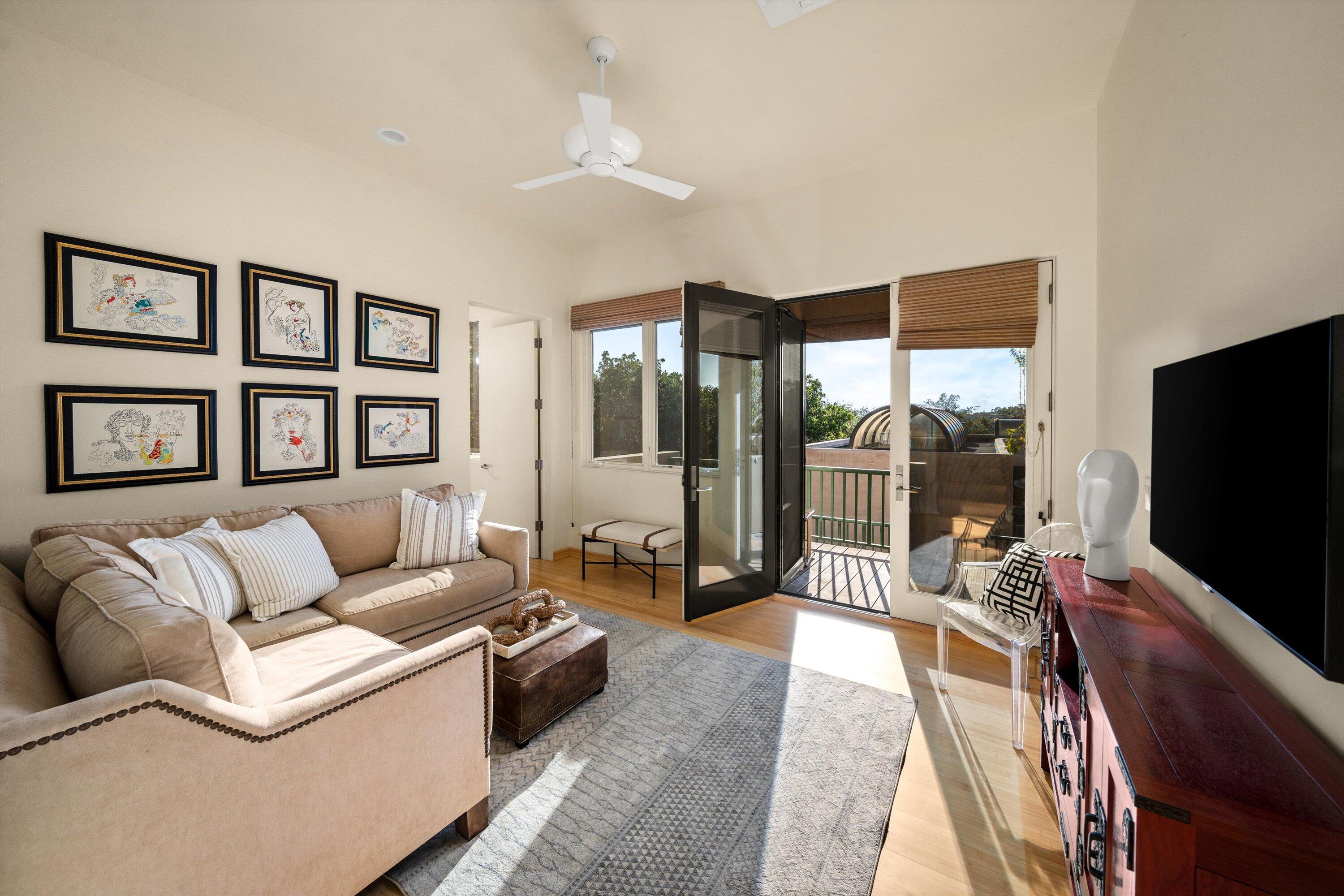 930 Monte Drive Santa Barbara, CA 93110 - Photo 30 of 49 a living room with furniture large window and a flat screen tv