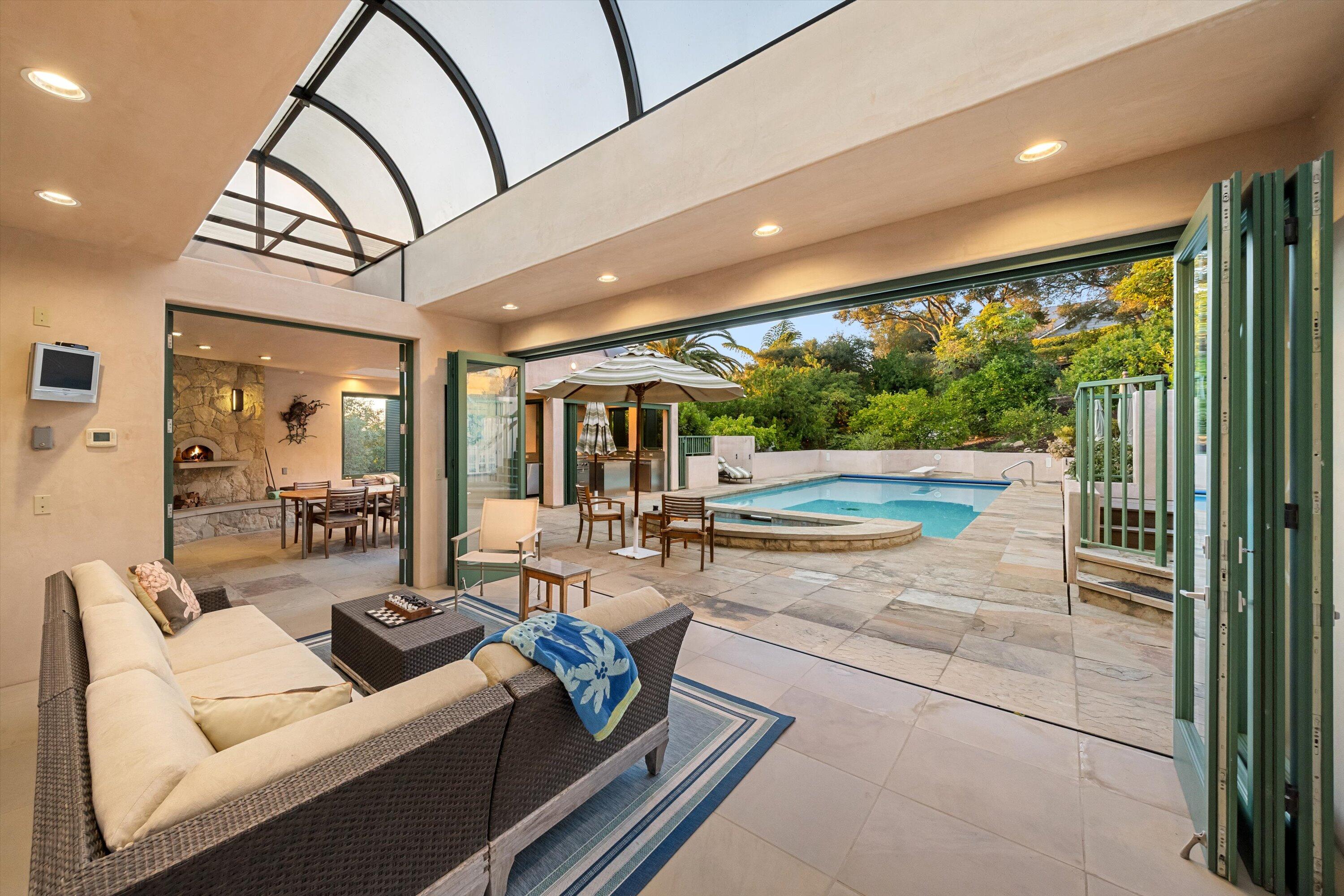 930 Monte Drive Santa Barbara, CA 93110 - Photo 36 of 49 a living room with furniture and a floor to ceiling window