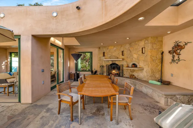 a kitchen with kitchen island granite countertop lots of counter top space and stainless steel appliances