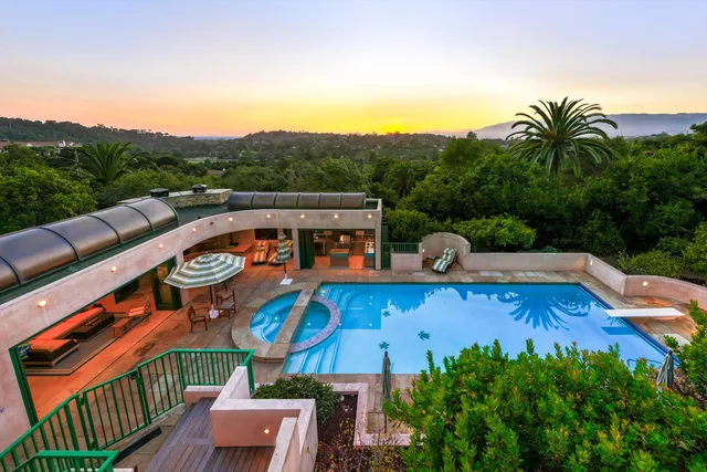 swimming pool view with a backyard space