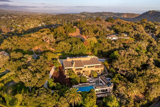 a view of a town with mountains in the background