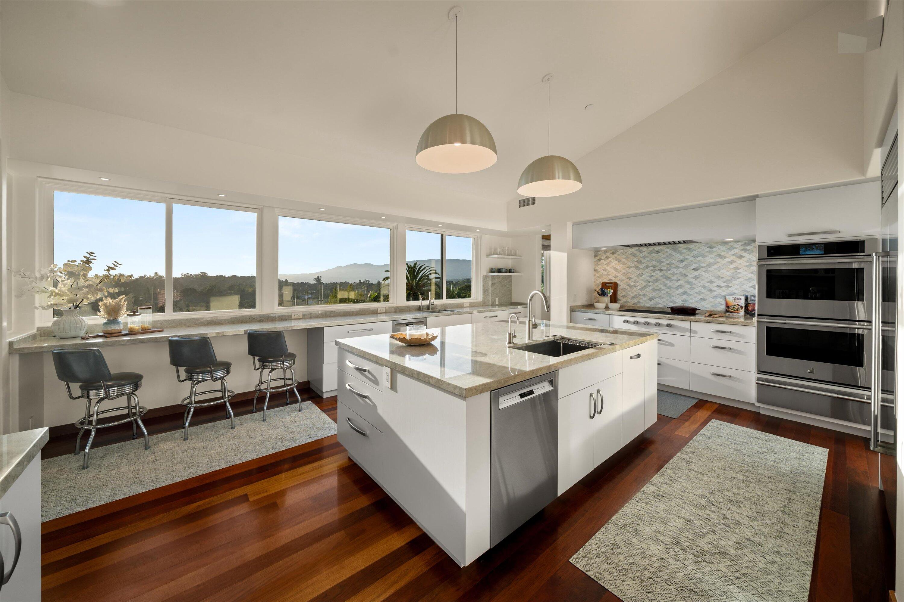 930 Monte Drive Santa Barbara, CA 93110 - Photo 9 of 49 a kitchen with a stove window and chairs