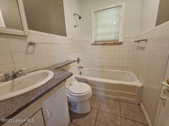 4508 46th Street Lubbock, TX 79414 - Photo 3 of 9 a bathroom with a sink a toilet and bathtub