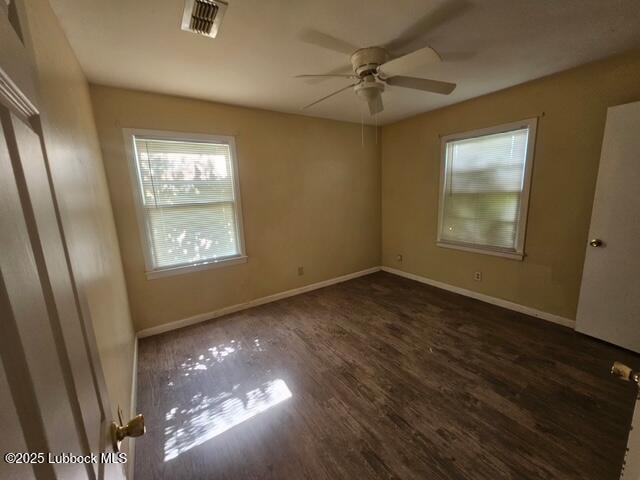 4508 46th Street Lubbock, TX 79414 - Photo 4 of 9 an empty room with windows and closet