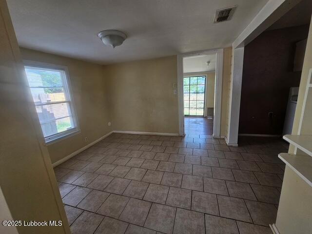 4508 46th Street Lubbock, TX 79414 - Photo 8 of 9 a view of an empty room with glass door and wooden floor