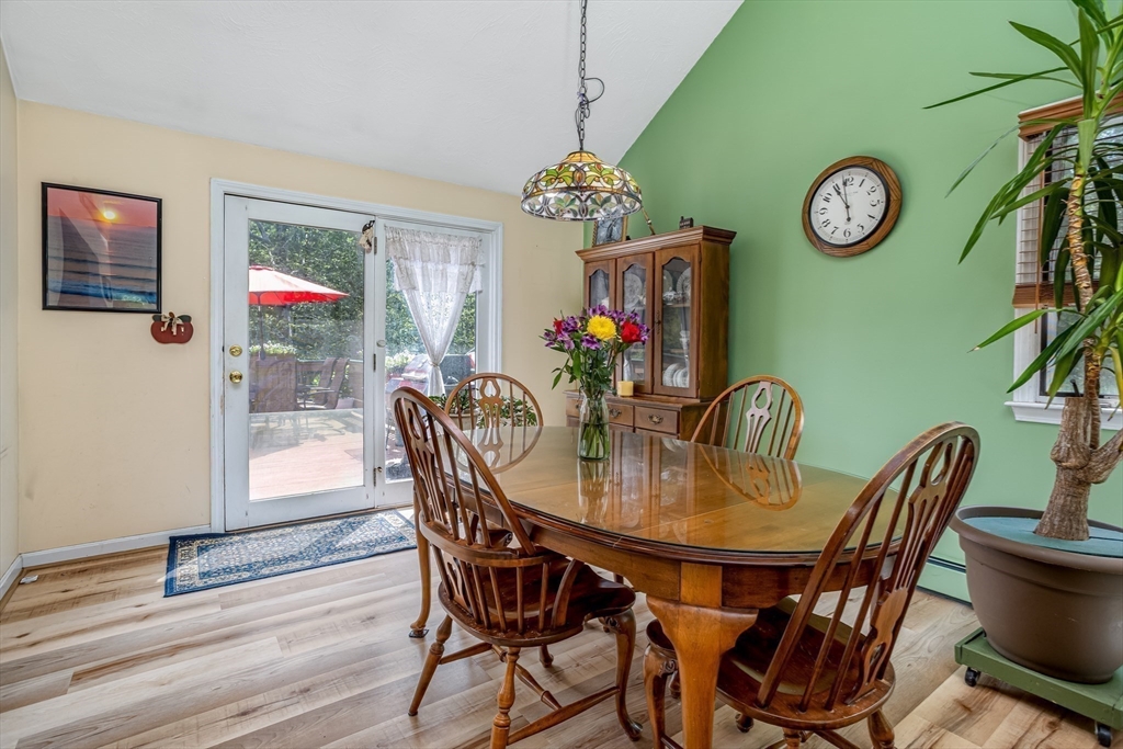 188 Hubbardston Road Templeton, MA 01468 - Photo 12 of 33 a dining room with furniture wooden floor and a clock