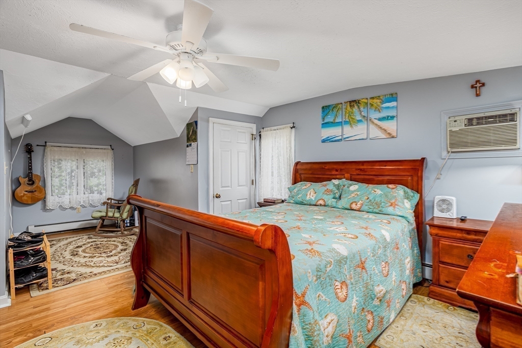 188 Hubbardston Road Templeton, MA 01468 - Photo 15 of 33 a bedroom with bed and paintings on the wall