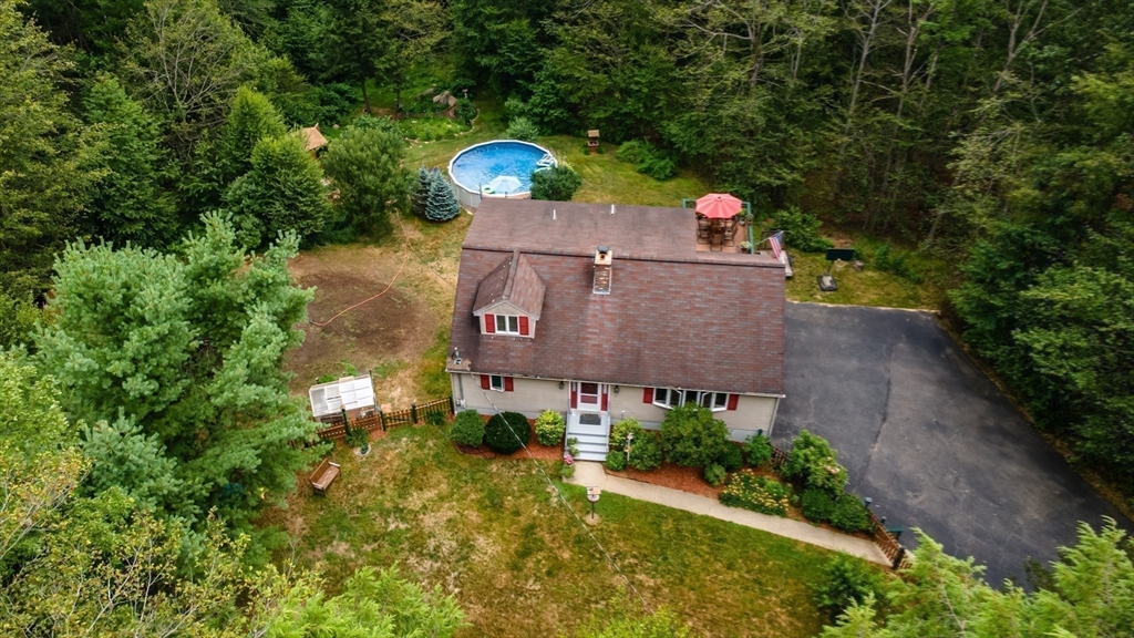 188 Hubbardston Road Templeton, MA 01468 - Photo 23 of 33 a view of a house with a yard and a wooden fence