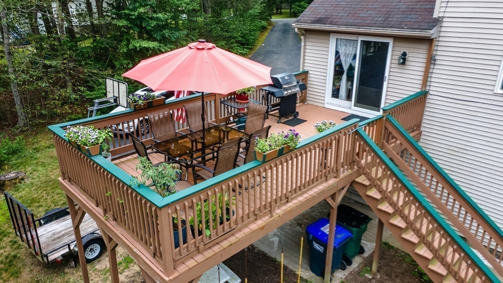 188 Hubbardston Road Templeton, MA 01468 - Photo 24 of 33 a view of a balcony with wooden floor and umbrella