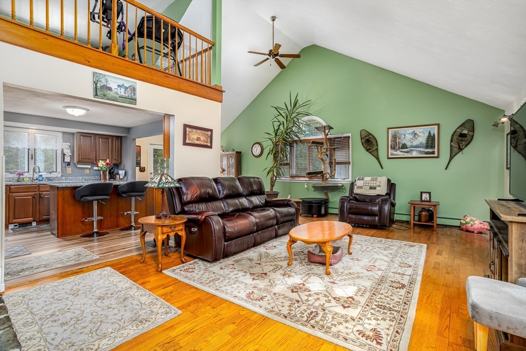 188 Hubbardston Road Templeton, MA 01468 - Photo 3 of 33 a living room with furniture a rug and kitchen view